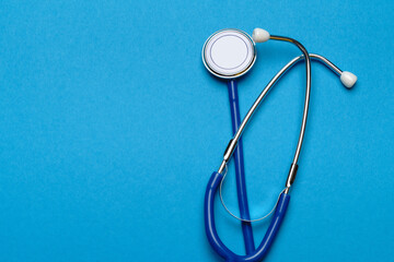 Top view of Medical stethoscope on blue background