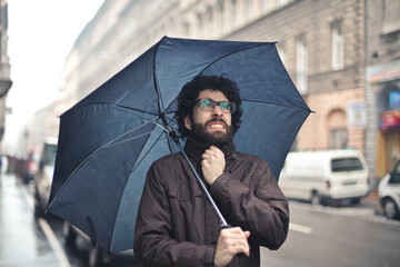 man in the street with umbrella