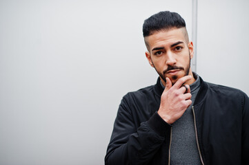 Portrait of stylish arab beard man wear grey turtleneck and black jaket. Arabian model guy against...