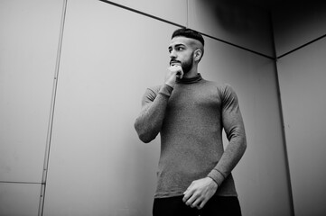 Portrait of stylish arab beard man wear grey turtleneck. Arabian model guy against steel wall.
