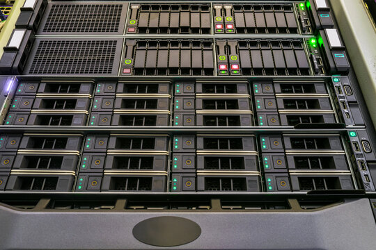 The front panel of hosting servers is in the datacenter. Modern hardware of the Internet provider. Computer hardware works in the server room.