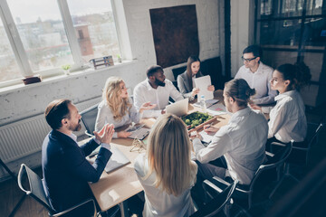 Portrait of nice attractive elegant stylish experienced coworkers attending meeting ceo boss chief discussing finance income growth money budget at loft industrial style interior workplace workstation