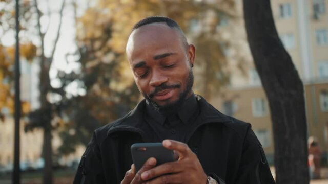 Happy african black man taking selfie using smartphone sharing lifestyle on social media