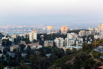 Fototapeta premium Modern urban architecture in Haifa, Israel. Fall season. Cityscape and skyline at sunset