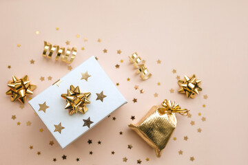 Gift box and various golden items.