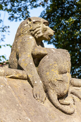 Fototapeta na wymiar Baboon monkey sculpture from the Animal Wall of Cardiff Castle in Wales built in 1890 in Castle Street which is a popular travel destination tourist attraction landmark of the city stock photo image