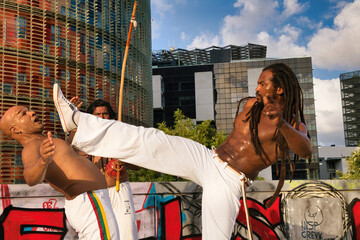Capoeira team training in the central square of the city.