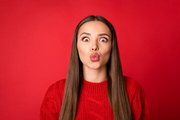 Portrait of pretty girl send air kiss wear woolen pullover isolated over bright red color background