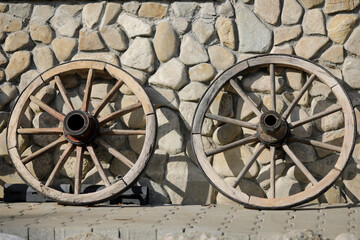 Fototapeta na wymiar Old wooden cart wheels