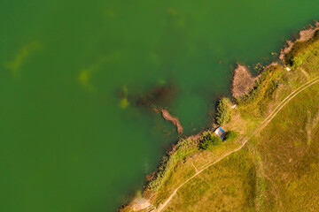 Aerial view of lake and embankment from drone pov