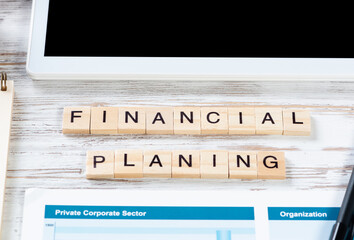 Financial planning concept with letters on cubes