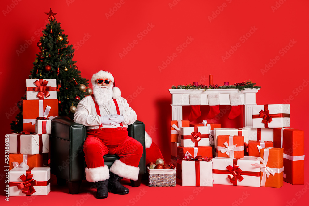 Sticker Portrait of his he attractive funky fat overweight cheery glad Santa father sitting in armchair in decorated living-room festal spirit isolated bright vivid shine vibrant red color background