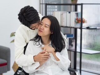 Obraz na płótnie Canvas Asian lesbian couple having romantic moments together at home.