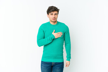 Fototapeta premium Young cool man taking an oath, putting hand on chest.
