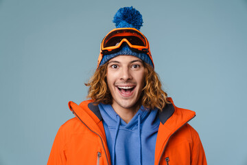 Caucasian joyful sportsman smiling and looking at camera