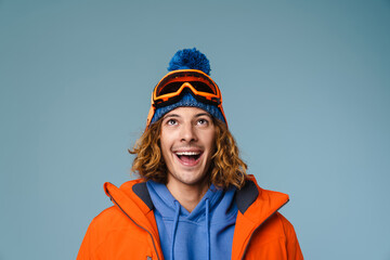 Caucasian joyful sportsman smiling and looking upward