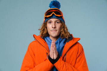 Caucasian tense sportsman posing with palms together