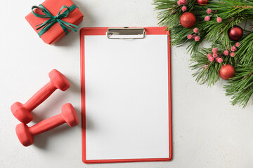Christmas empty blank with fir branches and gift,red dumbbells on white background with copy space....