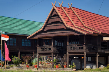 Two colorful stilted houses in a bugis neighborhood in South Sulawesi, Indonesia