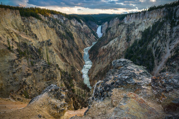 lower falls of the yellowstone national park from artist point at sunset, wyoming, usa