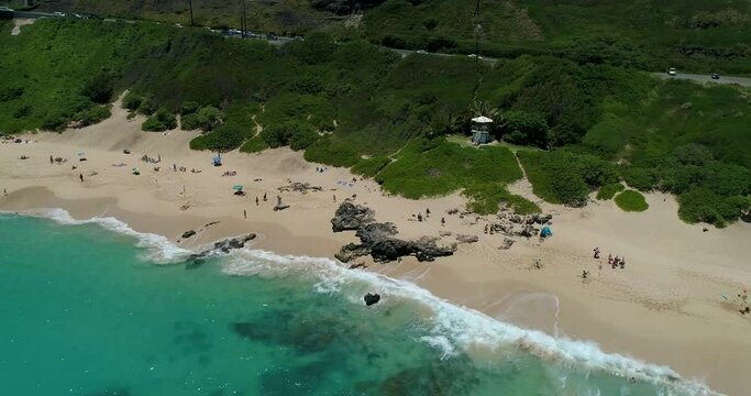 4K right to left closer tracking aerial drone shot of Sandy Beach park on the eastern side of Oahu, Hawaii,USA