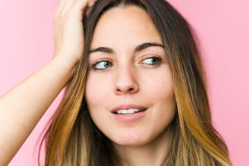 Fototapeta premium Young beautiful woman isolated on pink background