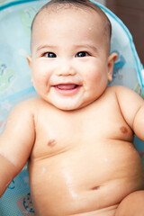 Cute happy Baby Taking Bath