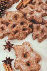 Ginger cookies and some spices on the tablecloth.