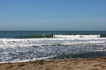 Surfing in corona times at Forte dei Marmi, Tuscany, Italy