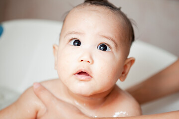 Cute happy Baby Taking Bath