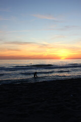 Fototapeta premium Surfing in corona times at Forte dei Marmi, Tuscany, Italy