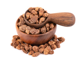 Tigernuts isolated on white background. Chufa nuts or tiger nuts in wooden bowl and spoon.