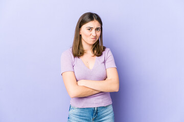 Young caucasian woman unhappy looking in camera with sarcastic expression.