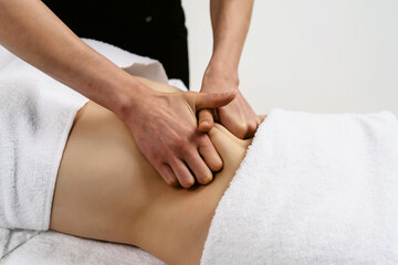 Anti cellulite massage fat female belly after pregnancy therapy in beauty salon. Perfect skin fat burning beauty concept