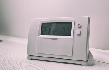 The thermostat on the wooden table
