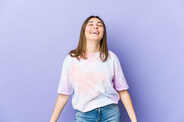 Young caucasian woman relaxed and happy laughing, neck stretched showing teeth.