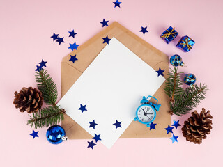 Christmas tree in envelope, minimal New Year s card. Spruce branch on pink background. Holidays, Congratulation concept, blue ball