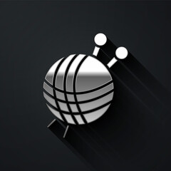 Silver Yarn ball with knitting needles icon isolated on black background. Label for hand made, knitting or tailor shop. Long shadow style. Vector Illustration.