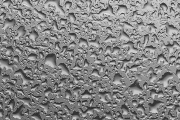 water drops on glass background texture. rain on the grey window