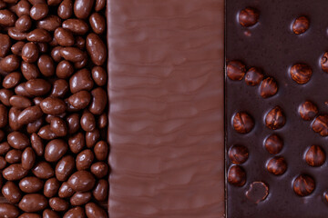 Chocolate bars and chocolate glazed peanuts. Chocolate bar with hazelnuts. Chocolate bar with texture.