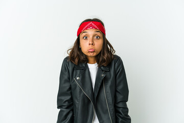 Young latin rocker woman isolated on white background