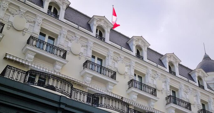 Typical Building Facade In Monte-Carlo Monaco, Belle Epoque Architecture With Monaco Flag Waving In The Wind - DCi 4K Video
