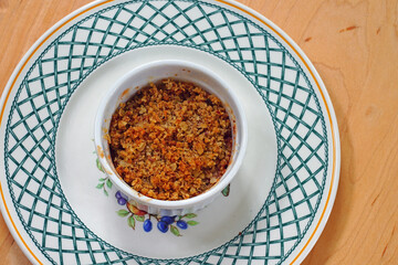 Apple and oat crumbles in individual ramekins