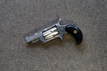 pocket revolver on the table