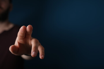 Obraz premium young man touch something with his finger