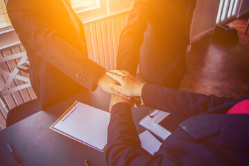 The investors and the business team join hands to show the agreement and the cooperation in the investment to do business together. Concept of consulting and investment in doing business together