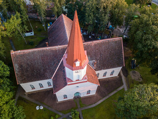 Aerial close up on lutheran church tower with red roof, Smiltene, Latvia
