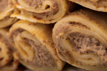 Meat stuffed crepes close-up. Macro shot.