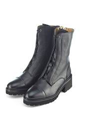 Beautiful autumn leather boots with a high top with laces and a massive sole with a low heel, isolated on a white background with a shadow.