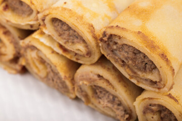 Meat stuffed crepes close-up. Macro shot.